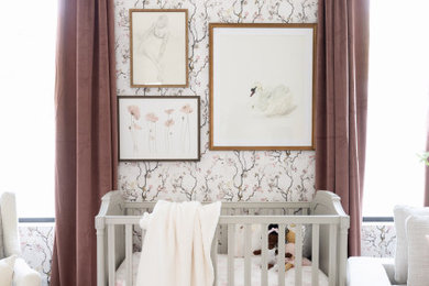 Inspiration for a transitional girl wallpaper nursery remodel in Phoenix with pink walls