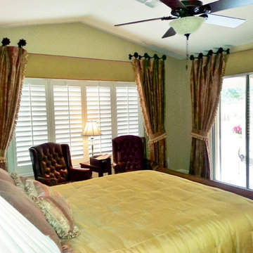 Bedroom complete with Conforter,pillows ,Draperies over cornice boxes.