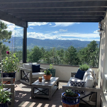 Pergola Covered Deck with Glass Wind Break in Monument