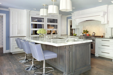 Inspiration for a large transitional u-shaped ceramic tile open concept kitchen remodel in New York with an undermount sink, white cabinets, marble countertops, white backsplash, porcelain backsplash, paneled appliances and an island