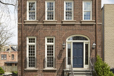 Large traditional three-storey brick townhouse exterior in Chicago.