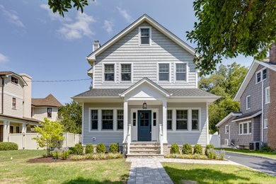Large transitional gray three-story mixed siding and shingle house exterior idea in New York with a shingle roof and a gray roof