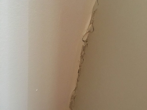 Cracks Where Ceiling Meets Wall Stairwell