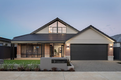 Photo of an industrial two-storey brick red house exterior in Perth with a gable roof and a tile roof.