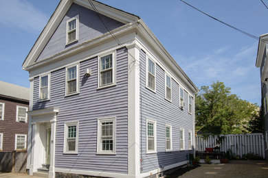 Traditional blue three-story wood exterior home idea in Boston