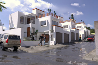 他の地域にある中くらいな地中海スタイルのおしゃれな家の外観 (コンクリート繊維板サイディング、タウンハウス) の写真