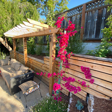 Arbor in Front of Retaining Wall
