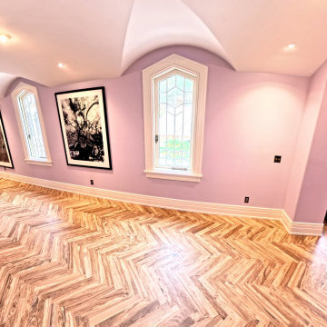 Custom Luxury Hallway with Vaulted Ceilings and Herringbone Flooring
