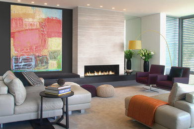 This is an example of a large modern formal open concept living room in Sydney with multi-coloured walls, a ribbon fireplace, a stone fireplace surround and multi-coloured floor.