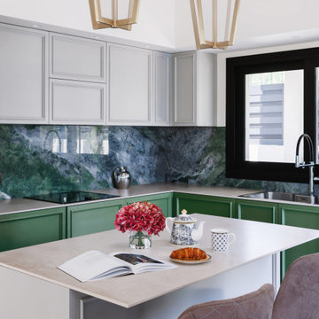 Neoclassical Kitchen with Green Cabinets and Marble Splashback