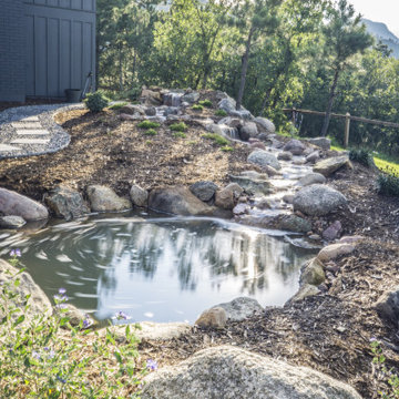 Hillside Outdoor Living With a Natural Water Feature
