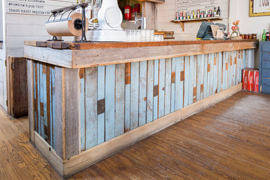 Inspiration for a shabby-chic style home bar remodel in Chicago