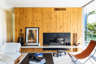 This is an example of a contemporary living room in San Francisco with a ribbon fireplace.
