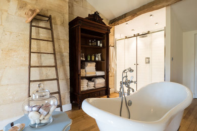 Large country white tile and subway tile medium tone wood floor and brown floor bathroom photo in DC Metro with beige walls