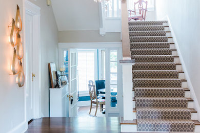 Example of a mid-sized transitional dark wood floor and brown floor foyer design in Chicago with beige walls