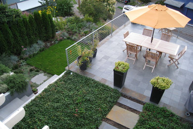 Design ideas for a contemporary backyard stone landscaping in Seattle.