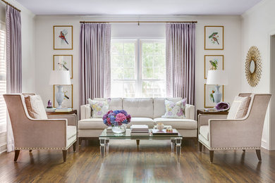 Living room - mid-sized traditional formal and enclosed medium tone wood floor living room idea in Little Rock with no tv and white walls