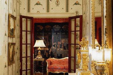 Small ornate dark wood floor hallway photo in Bridgeport with multicolored walls