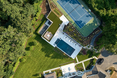 Minimalist backyard pool house photo in New York