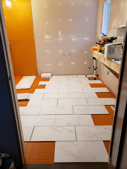 Lay tile parallel or perpendicular to soaking tub?