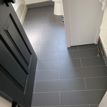 Plank tile Flooring and Penny tile Backsplash