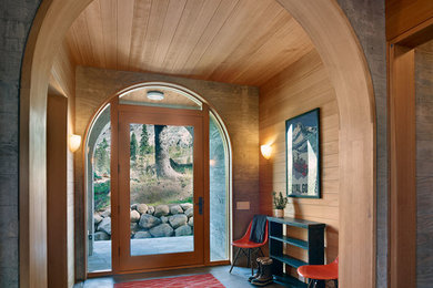 Inspiration for a rustic gray floor single front door remodel in San Francisco with a glass front door