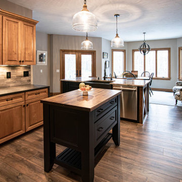 Reconfigured kitchen with new islands, countertops, backsplash