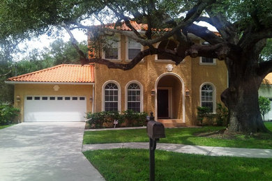Tuscan home design photo in Tampa