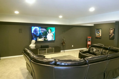 Photo of a contemporary home cinema in Raleigh.