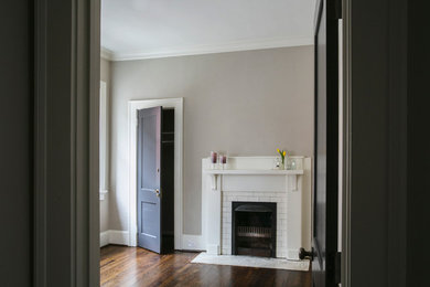 Mid-sized arts and crafts guest dark wood floor bedroom photo in Atlanta with a standard fireplace and a tile fireplace