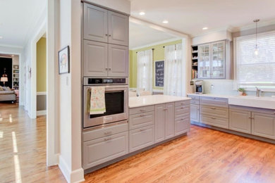 Example of a mid-sized transitional kitchen design in Other with quartz countertops