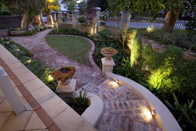 Inspiration for a contemporary front yard garden in Perth with a garden path and brick pavers.