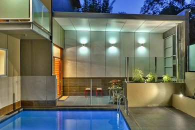 This is an example of a contemporary indoor pool in Brisbane.