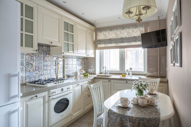 Inspiration for a mid-sized traditional l-shaped separate kitchen in Moscow with an integrated sink, raised-panel cabinets, solid surface benchtops, ceramic splashback, white appliances, porcelain floors, white cabinets, multi-coloured splashback and no island.