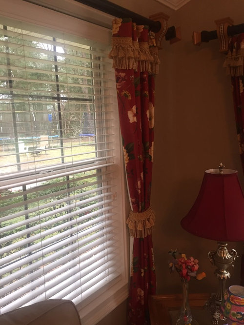 Hang curtain rods different heights in same room