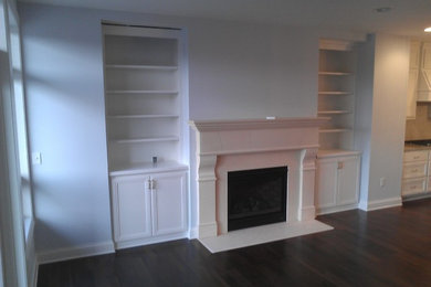 Example of a mid-sized trendy open concept dark wood floor living room design in Minneapolis with blue walls, a standard fireplace and a stone fireplace