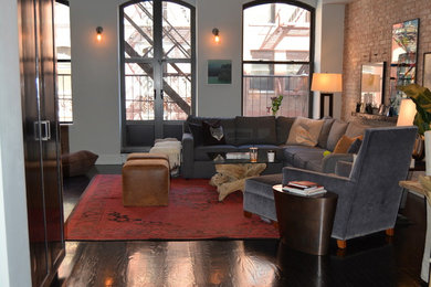 Mid-sized mountain style loft-style dark wood floor family room photo in New York with gray walls