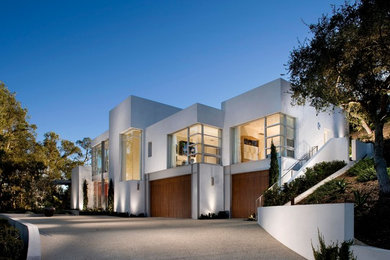 Photo of a large modern two-storey white exterior in Santa Barbara with a flat roof.