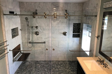 Bathroom - large contemporary master gray tile and marble tile bathroom idea in Las Vegas with black cabinets, gray walls, an undermount sink, quartz countertops and beige countertops