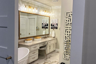Bathroom - mid-sized transitional master beige tile and ceramic tile ceramic tile, multicolored floor and single-sink bathroom idea in Houston with shaker cabinets, white cabinets, a bidet, beige walls, an undermount sink, quartzite countertops, beige countertops and a built-in vanity