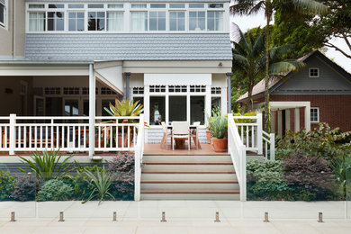 Inspiration for a large traditional backyard deck in Sydney with a roof extension.