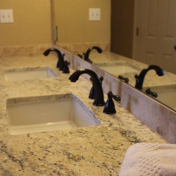 Undermount Marble Tub with Bianco Romano Granite and Frameless Shower