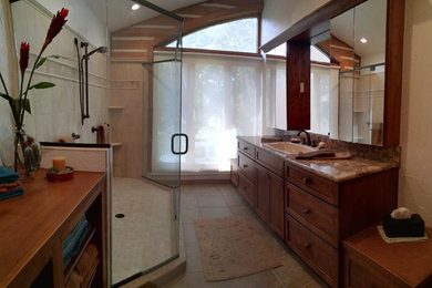 Inspiration for a large craftsman master beige tile and porcelain tile porcelain tile doorless shower remodel in Tampa with a drop-in sink, shaker cabinets, dark wood cabinets, glass countertops, a two-piece toilet and white walls