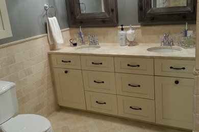 Mid-sized elegant master beige tile and stone tile travertine floor bathroom photo in Chicago with shaker cabinets, white cabinets, a two-piece toilet, gray walls and an undermount sink
