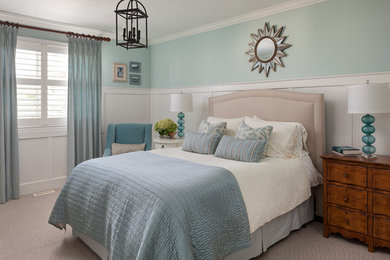 Example of a transitional bedroom design in Toronto with blue walls