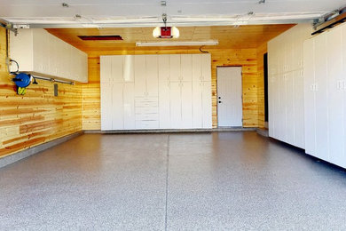 Inspiration for a mid-sized eclectic attached two-car garage remodel in St Louis