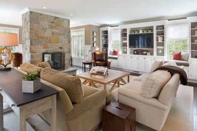 Inspiration for a mid-sized transitional open concept family room in New York with dark hardwood floors, a two-sided fireplace, a stone fireplace surround, a wall-mounted tv, beige walls and brown floor.