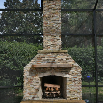 Outdoor kitchen with fireplace.