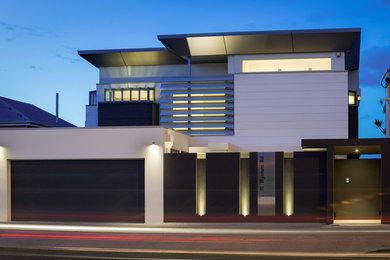 Photo of a large modern three-storey glass white exterior in Brisbane.