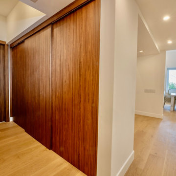 Walnut Storage Wall Lining the Hallway